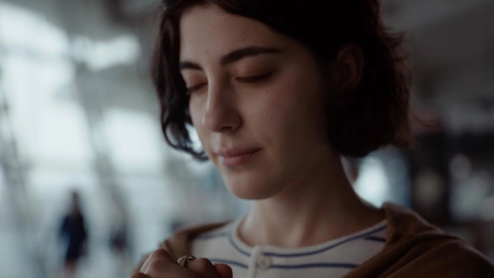 A woman pausing with Glorify Ring